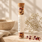 Rose Botanical Mineral Soak in a corked glass tube with dried rose petals